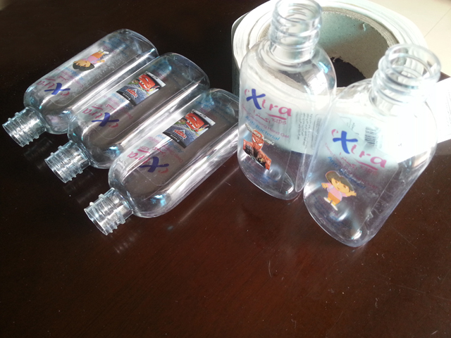 transparent labels labelled samples bottles plane surface Mrwan примерни прозрачни етикети и бутилки (3).jpg